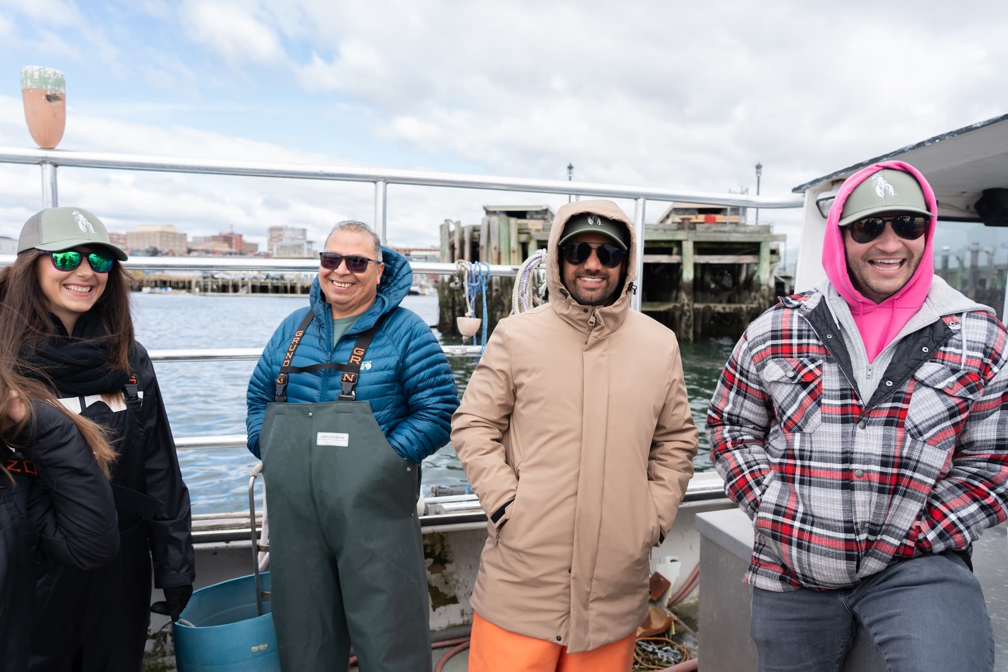 Cousin Lindsay, Luis, Karan, and Jim share a laugh on board a Lobster Boat in Casco Bay.