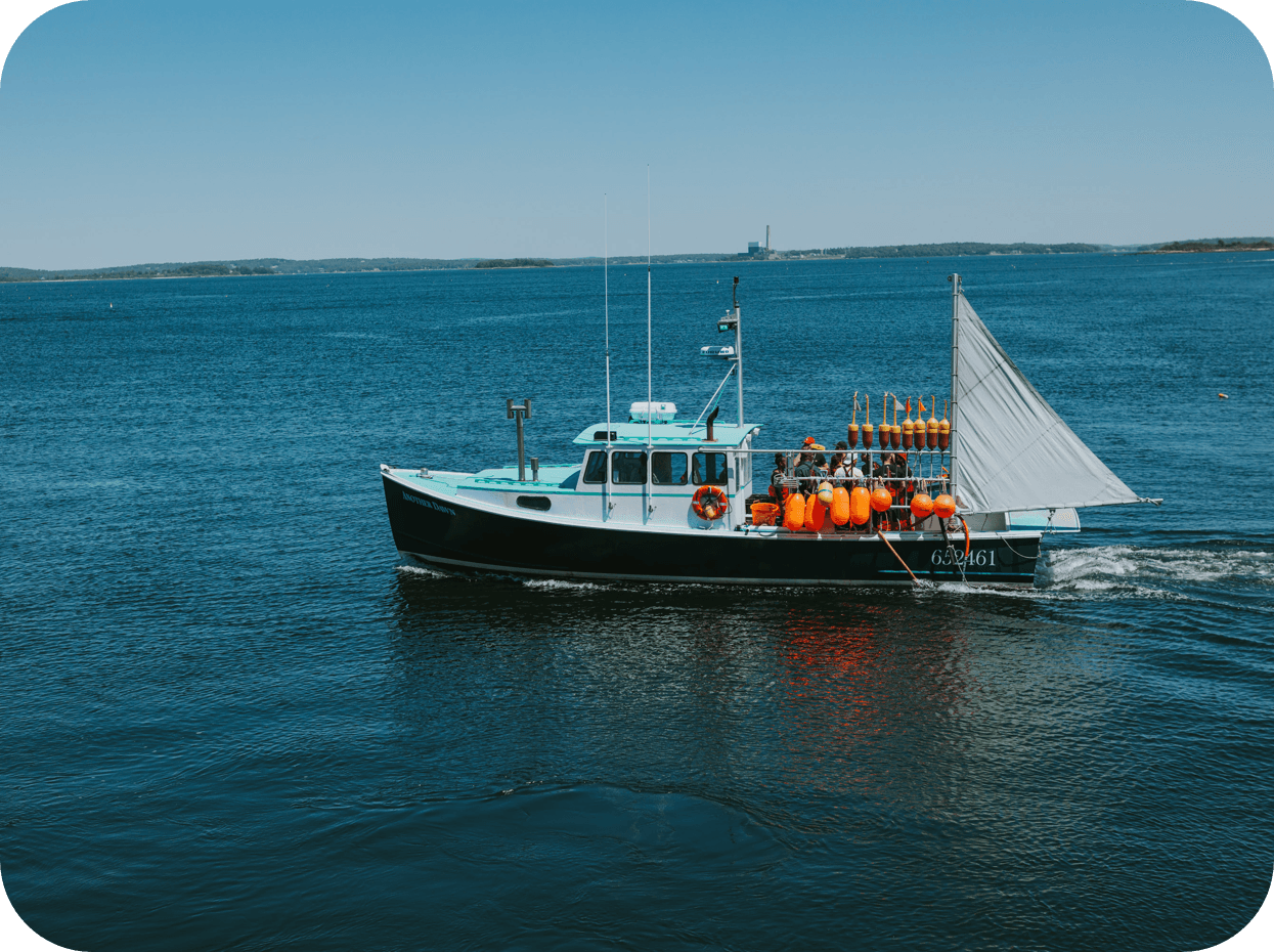 An image of a lobster boat headed out to fish.