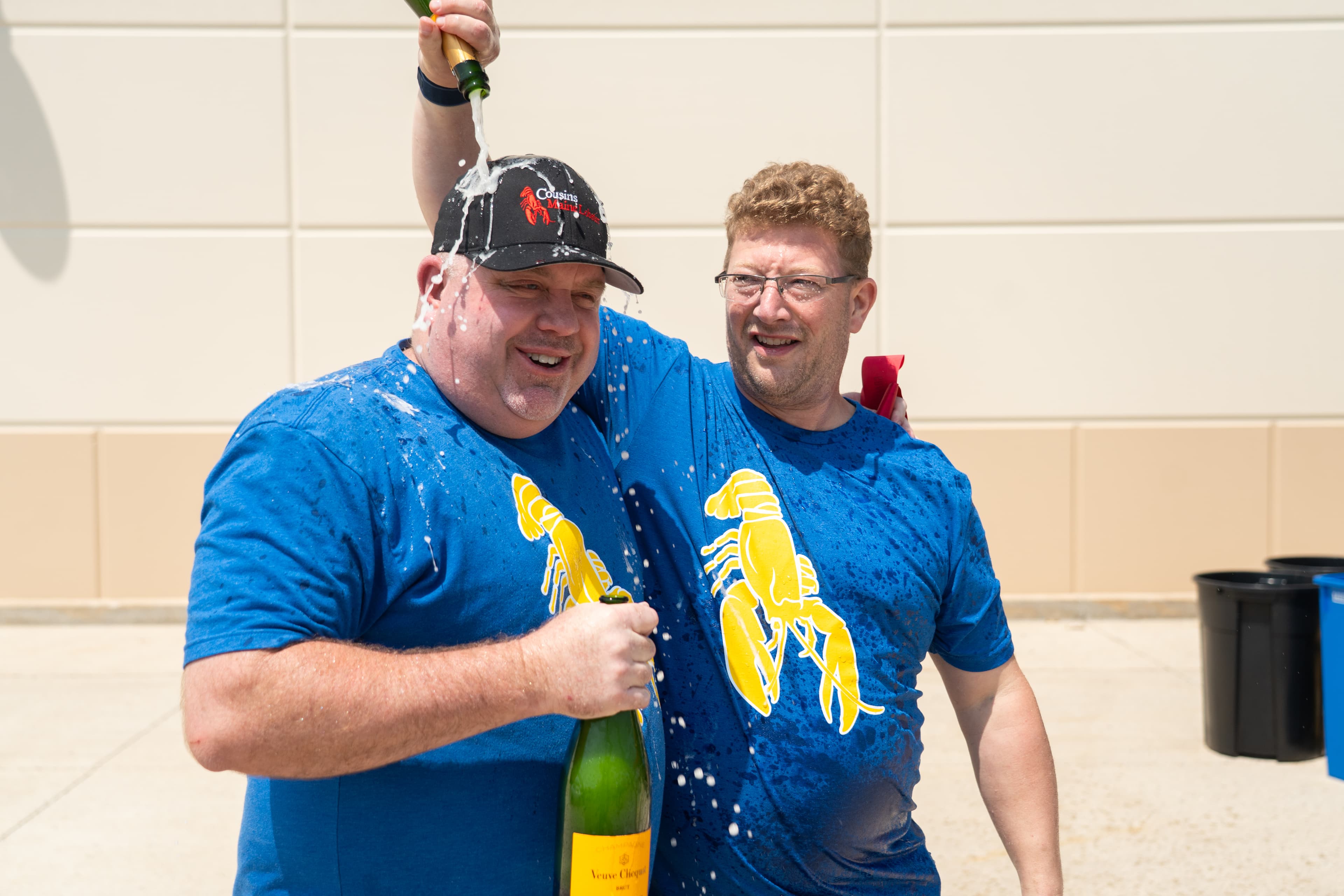 Cousins Chris & Kevin celebrate the opening of their Milwaukee Food Truck with a champagne toast